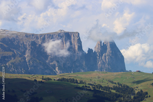 Alpine Landscape with Peaks Emerging Through Clouds