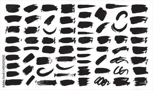 A collection of various black brush strokes and marks on a white background