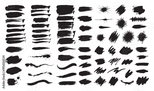 Collection of various black brush strokes and marks on a white background
