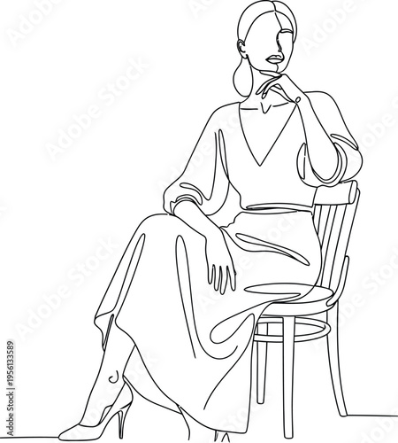 Woman sitting on a chair with her hand on her chin in a thoughtful pose wearing a dress and heels