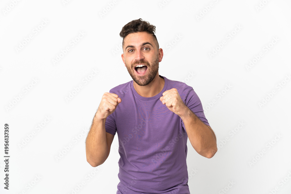 Fototapeta premium Caucasian man isolated on white background celebrating a victory in winner position
