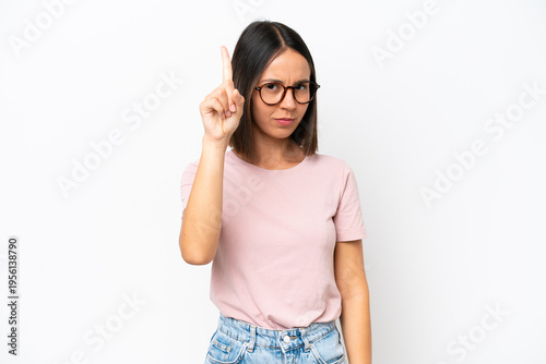 Young caucasian woman isolated on white background counting one with serious expression