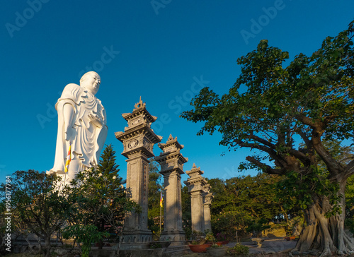 Standing Buddha statue against sky at Tong Lam Son Temple Nha Trang Vietnam