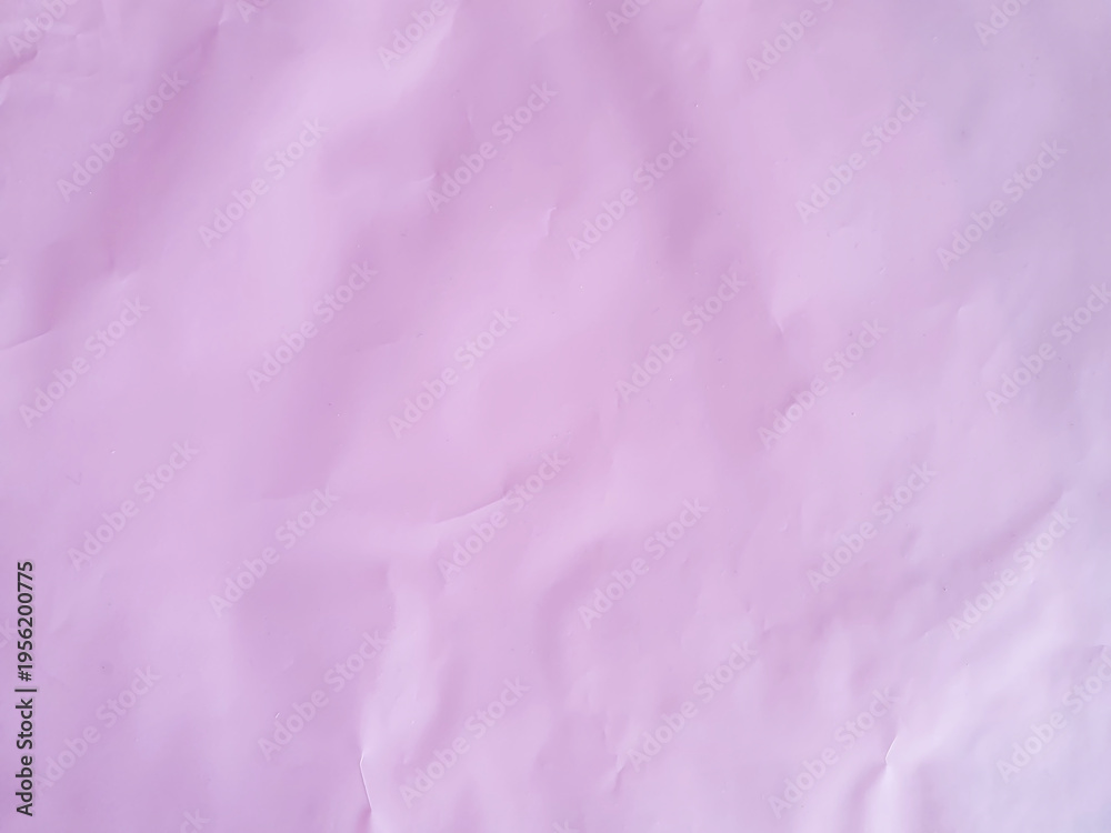 Fototapeta premium Delicate texture of light pink paper in silence with light folds. Translucent background for design, gift wrapping