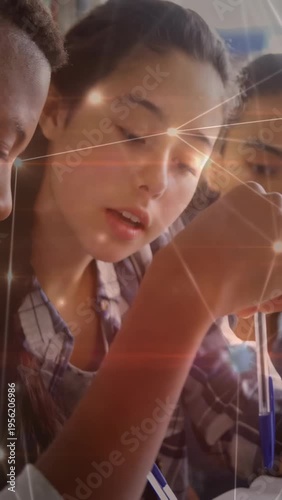 Vertical video: School pupil bringing blue pen down pointing notes peer leaning stars marking study