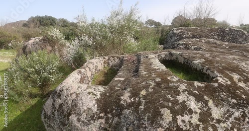 Ancient granite tombs in Los Barruecos archaeological landscape.