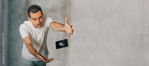 young man with a broken phone and copy-space