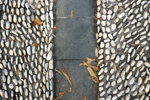 Reflexology paths, typically found in city parks or other public areas, are specially designed paths with a raised gravel surface for barefoot walking.