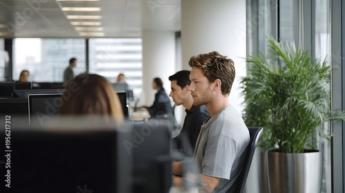 Professional colleagues working intently in a modern urban office environment