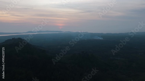 Captivating landscape view a stunning sunset, creating a tranquil atmosphere in the wilderness.