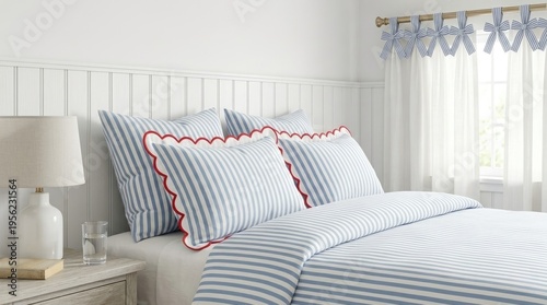 Blue and white striped bedding with red scalloped trim pillows and matching bow curtains, ideal for nautical bedroom decor or textile catalo