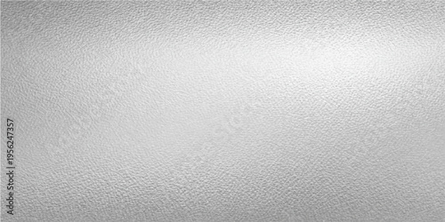 Subtle grey texture with a gradient light, this image offers a captivating blend of simplicity. The gradient light adds depth, creating a visually pleasing surface. 