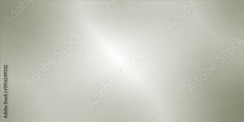 Subtle light softly illuminates a simple metallic surface, creating a visual interplay of textures and tones.