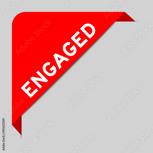 Red color of corner label banner with word engaged on gray background