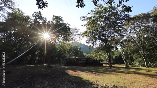 The video's natural background depicts the atmosphere of the ancient Sukhothai Historical Park, an educational site featuring ancient Buddha statues and pagodas.