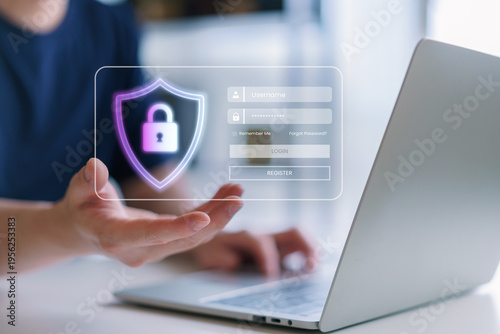 User displaying futuristic login interface with shield padlock icon on laptop, representing secure authentication, web privacy, personal data access, and cybersecurity network protection concept.