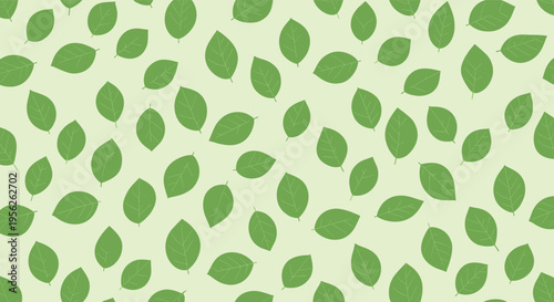 Soft pattern of identical green leaves scattered across a light lime green background provides a clean and natural aesthetic for design.