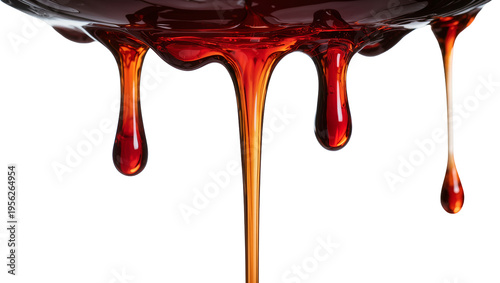Photos Isolated delicious sweet caramel syrup or honey flowing, creating artistic drops