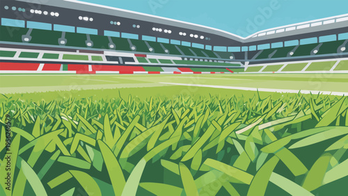 Grass in a sports stadium with empty seating and a clear sky in the background during day time