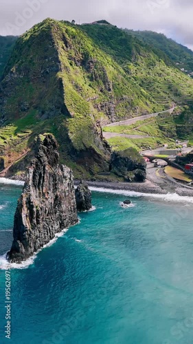 Atlantic Ocean coastline of Madeira Island featuring large sea stacks and rugged coastal rock formations