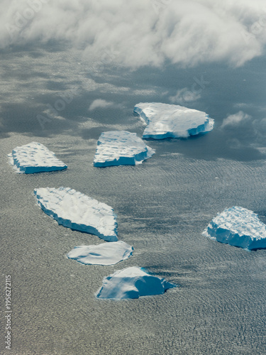 Aerial view of floating ice blocks on the Antarctic Ocean.