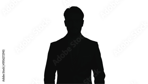 Silhouette of a confident businessman in a suit jacket stands facing forward in isolation against white.