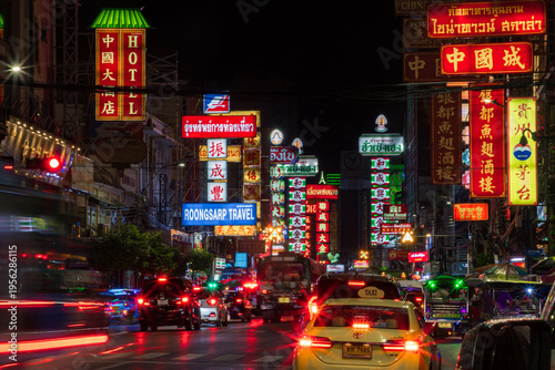 Stunning light trails of traffic at night in Yaowarat Road, Chinatown, Bangkok, Thailand