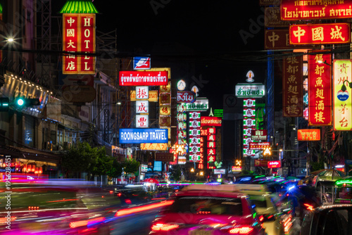 Stunning light trails of traffic at night in Yaowarat Road, Chinatown, Bangkok, Thailand