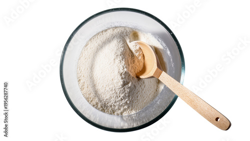 Bild auf Leinwand Isolated overhead shot of white flour in a transparent glass bowl with a wooden
