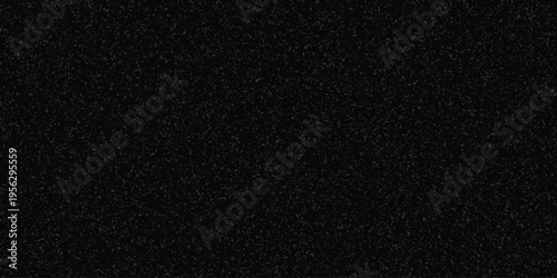 Dark speckled texture background with subtle gray granular pattern for abstract design and grunge effects