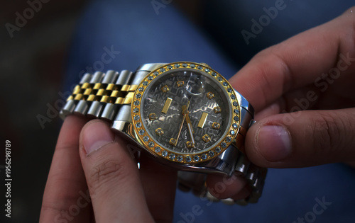 Luxury watches placed on a glittering glass floor