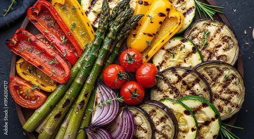 Overhead View of Vibrant Grilled Vegetables and Fresh Herbs Arranged on a Wooden Platter