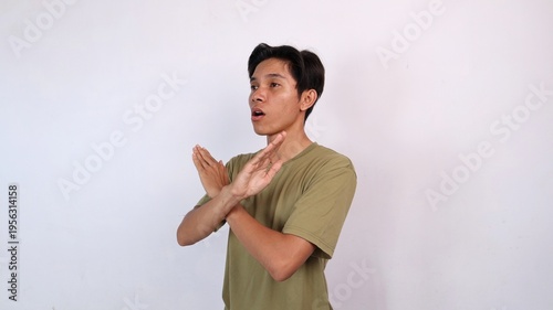Asian young man gesturing with both hands crossed, rejection