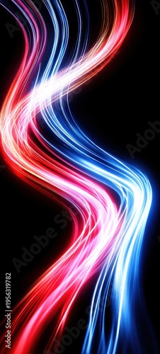 Abstract swirling red and blue light trails on a dark background
