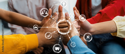Schilderij op canvas Startup company employee team stacking hand together symbolize successful group of business partnership and strong collective unity teamwork in community workplace in panoramic banner