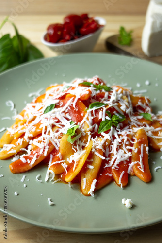 Italian pasta with tomato sauce and grated cheese, homemade meal and comfort food concept
