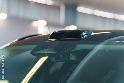 Autonomous driving technology with LiDAR sensor on car roof and ADAS cameras behind windshield