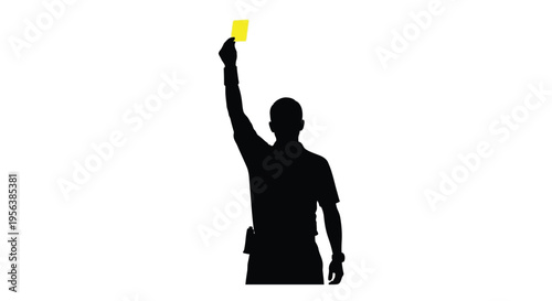 Silhouette of a referee displaying a yellow card during a game