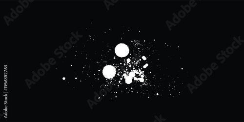 White color spray paint or graffiti design element on the black wall background.