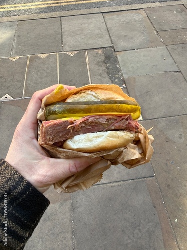 Salt beef bagel sandwich street food holding