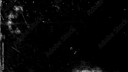 Monochrome grunge background featuring scratches, paint splashes, and halftones for creative design projects and artistic displays.
