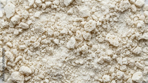 Macro texture of freeze-dried yogurt bites dust with crumb clusters. Snack ingredient background concept.
