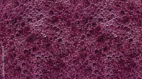 Macro background of maqui berry gel micro bubble field. Vibrant purple fruit texture concept.