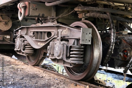 Close-Up of Train Wheel and Suspension System, Steel Bogie with Brake Components