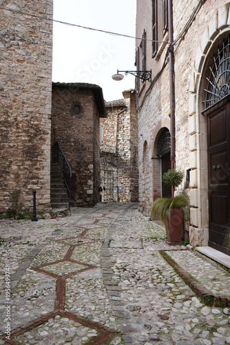 Medieval town of Narni. Umbria region, central Italy. Medieval city: a typical old street. Holidays in Italy. Ancient italian city rich in history. Italian old buildings. Cloudy day.  