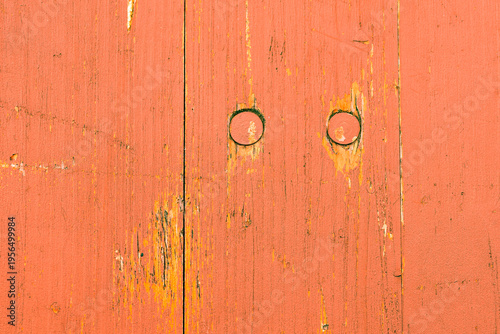 Fotografie eines Holzzauns in orangefarben, als Hintergrund für Designs....