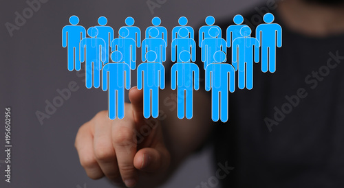 Hand pointing at a group of...