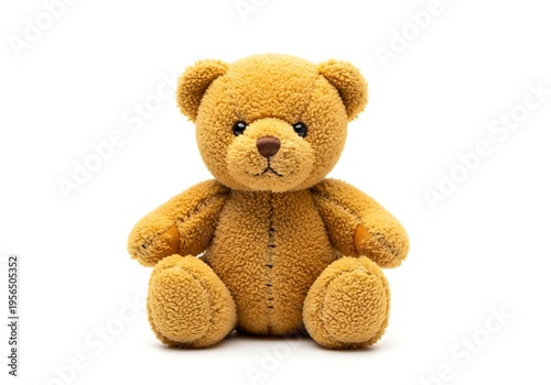 Cuddly brown teddy bear sitting upright isolated on white background with sweet expression