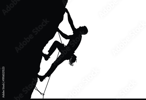 Silhouette of a rock climber in action on a cliff face