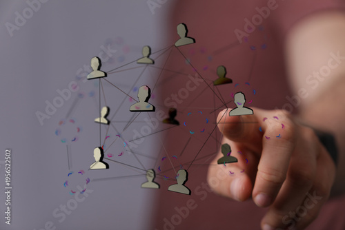 Hand pointing at a network ...